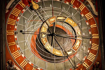 brown and red analog clock