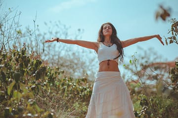 woman spreading both her arms
